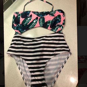 One piece suit with palm leaf and striped print